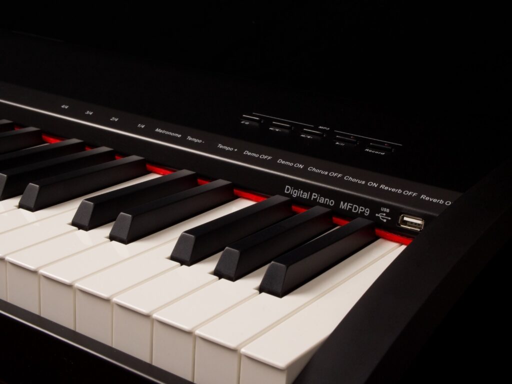 Montford Digital Piano. Far-right shot of black piano. Showing controls and USB port